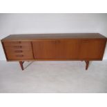 A mid-century teak sideboard