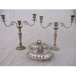 A pair of Sheffield plated candelabra along with a pair of entree dishes