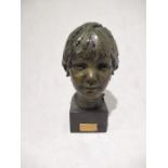 A bronze bust of a child entitled Hannah by Karen Newman (MRSS), dated 1973 - height 33cm