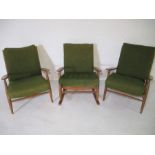 A pair of retro arm chairs, along with a matching rocking chair