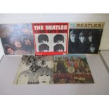 A collection of five 12" vinyl albums by The Beatles including three USA releases (Rubber Soul, A