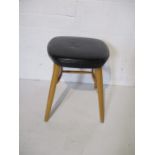 A Ben Chairs vinyl covered stool