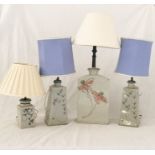 A pair of studio pottery lamps along with two others on a similar theme