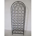 A wrought iron wine rack in the style of Arthur Unanoff (holds 39 bottles)