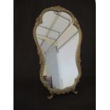An Atsonea freestanding decorative mirror with shell and foliate decoration