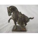 A small Tang style metal horse on stand with Verdigris. height 13.5cm