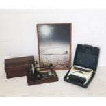 A portable singer sewing machine, an Adler typewriter and framed Concorde picture