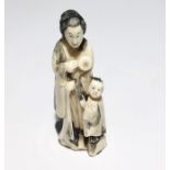 A 19th century Japanese ivory Okimono of a lady and child