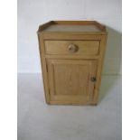 A small pine cupboard with one single drawer