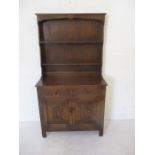 A small oak dresser with Gothic style panelling