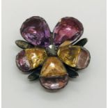 A SCM flower shaped Georgian brooch coloured paste petals around an old cut diamond, A/F