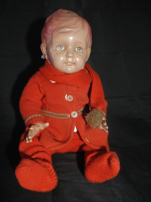 A vintage celluloid jointed doll