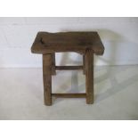 A rustic elm stool