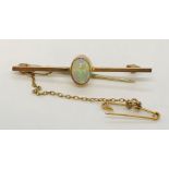 A 9ct gold bar brooch set with an opal