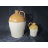 A stoneware cider flagon, marked Basleigh & Avery Merchants - Honiton, along with a smaller one