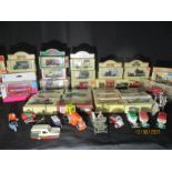 A collection of die cast model cars including Corgi, Lledo, Matchbox, Dinky and "Laurel and Hardy go