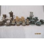 A collection of studio pottery including coffee sets and herb jars etc.