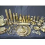 A collection of brassware including shells, vases, ashtrays, candlesticks, matchbox holder etc