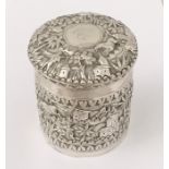 An Indian silver pot and cover decorated with hunting scenes etc.