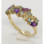 A 9ct dress ring set with amethyst & blue topaz stones with diamond chips