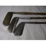 Three vintage golf clubs- two with Hickory shafts, including "The Leslie Putter", "Pyramid Putter"