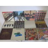 A collection of twelve 12" vinyl records by The Beatles including A Hard Day's Night (German