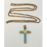 A rolled gold & turquoise cross on rolled gold chain