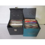 Two carry cases full of 7" vinyl singles including Elvis Presley, Simon & Garfunkel, The Beach Boys,