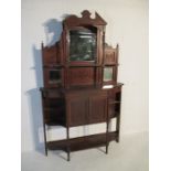 An Edwardian wall unit with mirror top