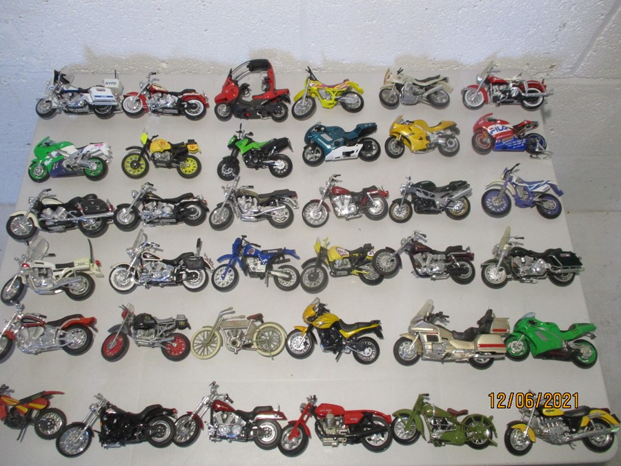 A collection of thirty six model motorcycles including Maisto etc.