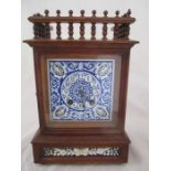 An oak mantle clock with decorated blue enamelled dial