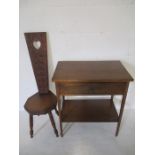 An oak occasional table along with a carved spinning chair.