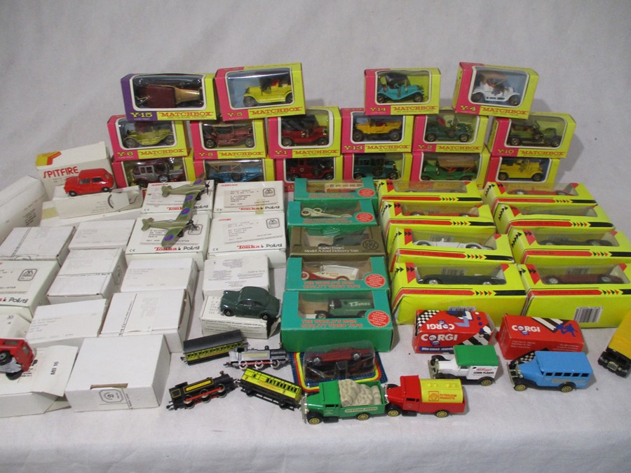 A collection of various die-cast vehicles including Matchbox, Corgi, Shell Classic Sportscars,