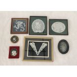 A collection of framed lace, samplers etc.