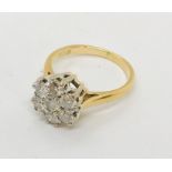 An 18ct gold diamond cluster ring with 7 diamonds