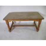 A large pine farmhouse table - height 78cm, length 168cm, width 87cm