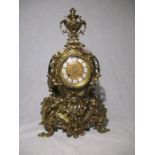 A French style brass clock case (no movement) with Roman numerals on face, Height 57cm