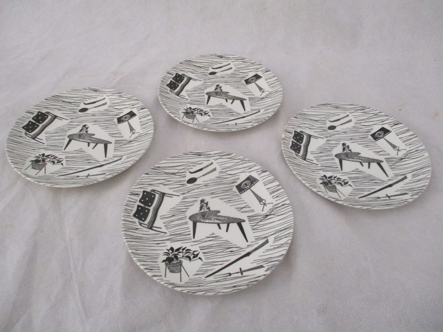 A set of four "Homemaker" pattern tea plates ( 17.5 cm diameter), two with small chips to underside