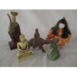 A collection of Oriental figures including a carved wooden boy on a water buffalo, Japanese