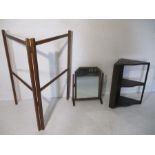 An vintage airer, mirror and corner shelving unit.