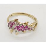 A 9ct gold gem set dolphin ring
