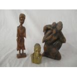 Three African carvings, wooden carved group of mother and child signed "Versaint, 85", a hardstone