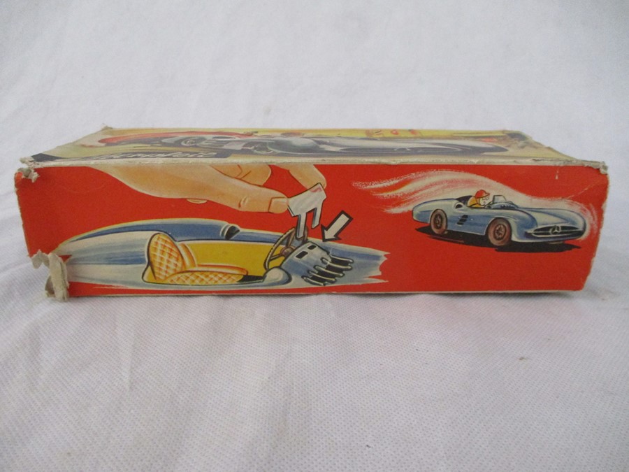 A Silberpfeil Mercedes Silver-Arrow tin plate friction driven open wheel racer model car, No 77, - Bild 9 aus 12