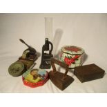 A collection of miscellaneous items including vintage tins, cast iron stamp, microscope ( A/F) etc.