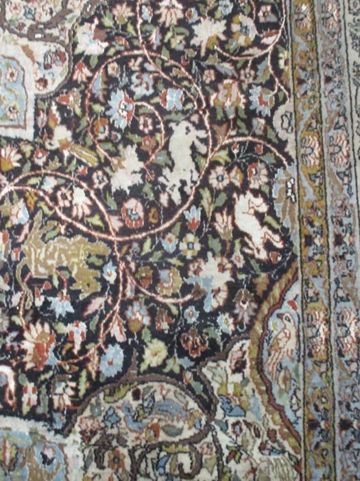 A black ground carpet with floral design, animals etc. approx 12ft x 8ft 10 inches - Image 3 of 8