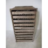 A vintage wooden apple storage unit with ten shelves