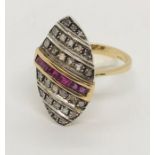 An Art Deco 14ct gold ring set with rubies and 28 diamonds