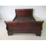 A mahogany sleigh bed - width 151cm