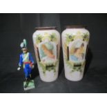 A turn of the century pair of glass vases, along with a figurine of a continental soldier