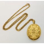A 9ct gold locket on a 9ct gold chain- total weight 28.1g